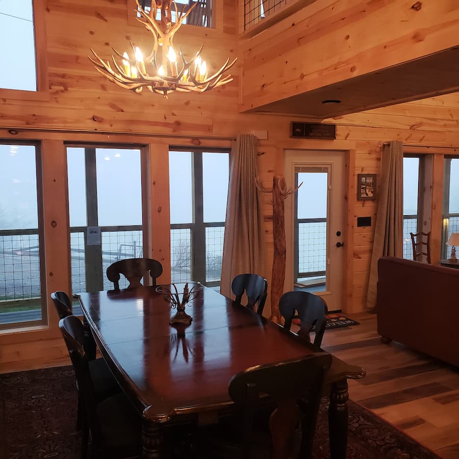 Patriot Dream cabin's dining room with an antler chandelier
